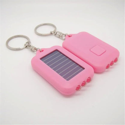 10 Pack Solar Mini Keychain Light Pocket Tiny LED Flashlight Rechargeable, Bright Small Flashlights Torch for EDC, Emergency, Power Outage,Camping, Party Favors (Pink)